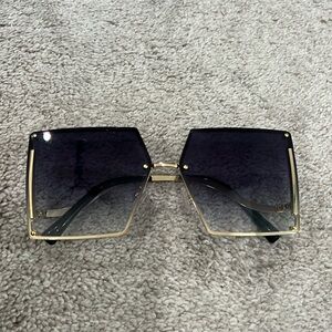 Brown & Gold sunglasses w/ rhinestones on side. Good condition.